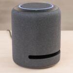a black round device with a blue and black circle