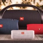 a group of jbl speakers on a table