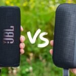 two hands holding a speaker, jbl vs bose